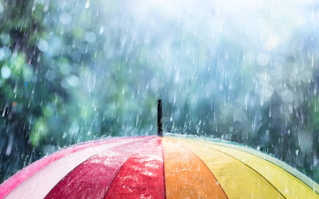 Using a rainbow unbrella on a rainy day in des moines iowa