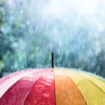 Using a rainbow unbrella on a rainy day in des moines iowa